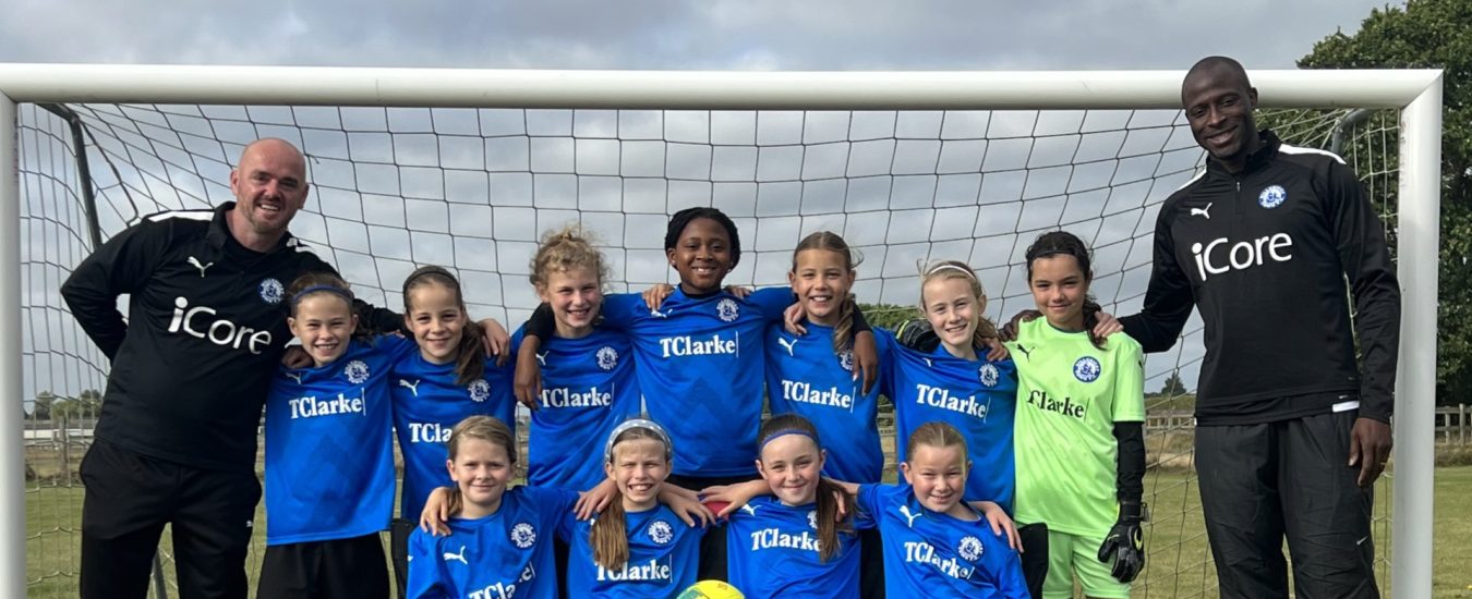 13025TClarke helps launch girls football team